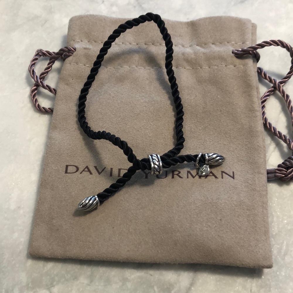 - David Yurman black cord bracelet with silver ends. 2 available.